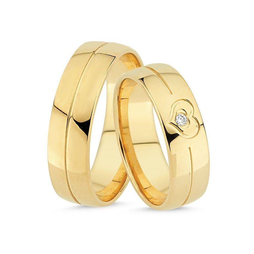 Nuran Smukke vielsesringe i 14 kt guld med blank finish, hjerte og 0,02 ct diamant.